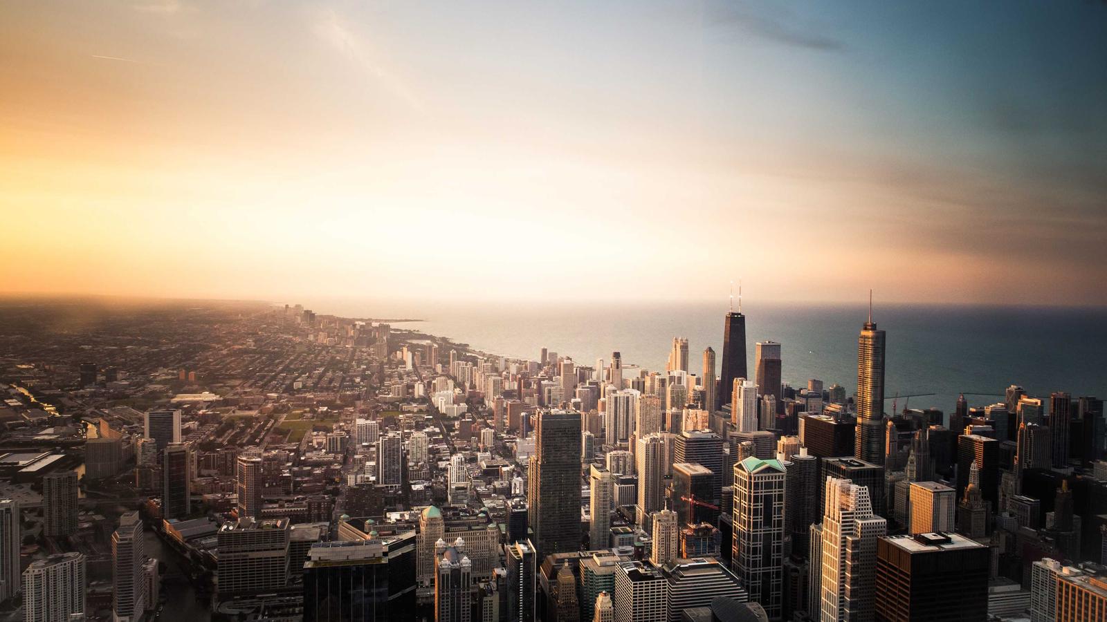 Aerial view of a financial district skyline at golden hour